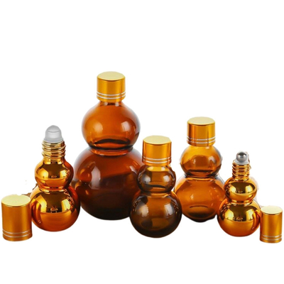 Anpassbare Premium 10ml/50ml/100ml Braunglas-Parfümöl-Roll-On-Flaschen mit goldenem Spiegel-Finish, doppelten goldenen Kappen & verdicktem Boden